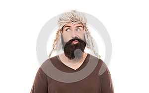 male winter fashion. mens beauty. funny bearded man portrait. mature man with beard in earflap hat.