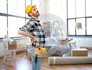 male worker or builder having back ache at home