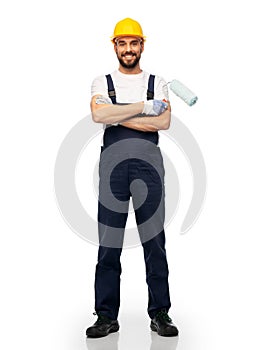 Male worker or builder with paint roller