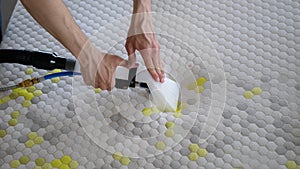 Male Worker Cleaning a mattress With Vacuum Cleaner.Professionally extraction method. Upholstered furniture. Mattress