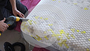 Male Worker Cleaning a mattress With Vacuum Cleaner.Professionally extraction method. Upholstered furniture. Mattress