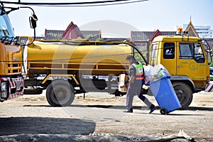 Male worker cleaning in public