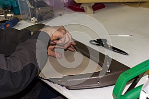 A male worker does manual work on skinning