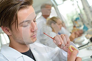 male worker duirng denture in progress