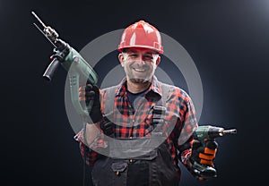 Male worker with an electric dril