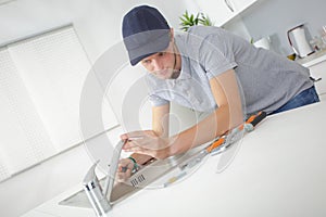 male worker fixing tap