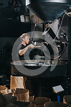 Male worker loading loading roaster