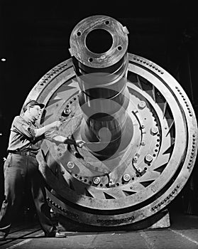 Male worker with massive machinery