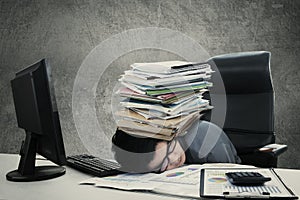 Male worker naps with document