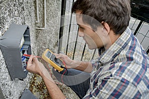 male worker reading meter