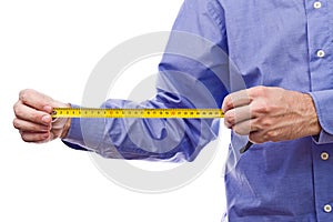 Male worker's hand holding Self-retracting tape measure meter photo