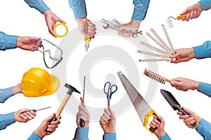 Male worker's hand holding various craft trade tools