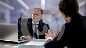 Male worker talking to arrogant boss ignoring him, opinion indifference at work
