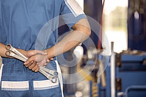 Male worker with tools in back pocket photo