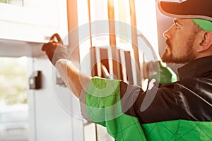 Male worker using fuel pump