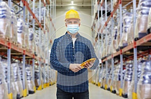 Male worker wearing face mask at warehouse