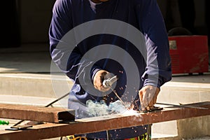 Male Worker Welding Steel or Metal