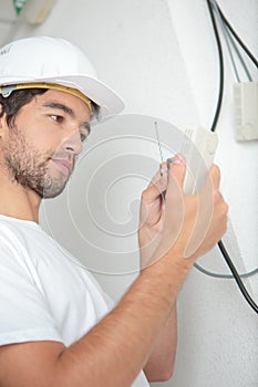 male worker wiring switch