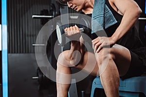 Male working out Bodybuilder with dumbbell weights at the gym.man bodybuilder doing exercises with dumbbell. training sport