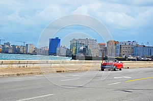 Malecon in Havana with typical american car, Cuba