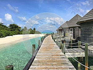 Maledives blue water with hotel locly hats