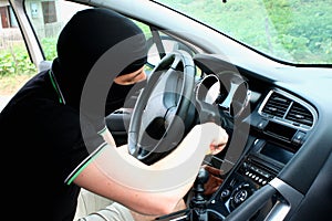The malefactor in the mask stealing car