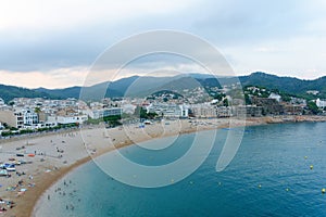 Malgrat de Mar, Catalonia, Spain, August 2018. View of the beach, the city and the distant mountains from the walls of the old for photo