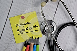 Malignant Hyperthermia text on sticky notes with office desk. Healthcare/Medical concept