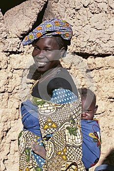 Malinese woman carries her child