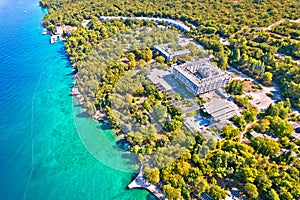 Malinska turquoise beach and old hotel ruins aerial view