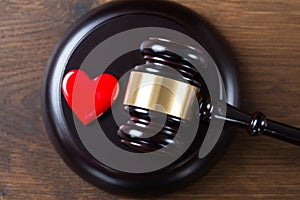 Mallet And Heart On Table In Courtroom