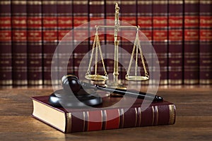 Mallet And Legal Book With Justice Scale On Table