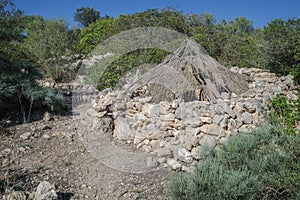 Mallorca, Spain - 8 Oct, 2023: Ancient charcoal huts at the Puig de sa Marisca archaeological site