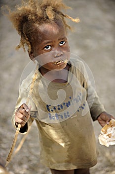 A Malnourished Haitian Girl Eating