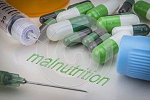 Malnutrition, medicines and syringes as concept