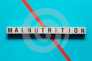 Malnutrition word concept on cubes