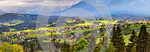 Malopolska village and green spring meadows on hills