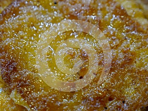 Malpua - Traditional Indian sweet pancake coated in sugar syrup made during Holi and Eid, ready to be sold in sweet shop.