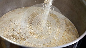 Malt is poured into the brew kettle for mashing