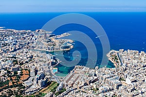 Malta aerial view. St. Julians San Giljan and Sliema cities. Harbours and coastline of Malta from above. Skyscraper in Paceville