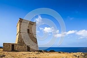 Malta - Ghajn Tuffieha watchtower at Golden Bay on a nice sunny day