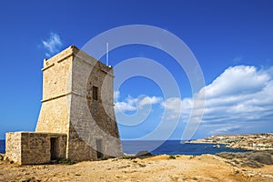Malta - Ghajn Tuffieha watchtower at Golden Bay on a nice sunny day