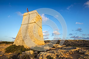 Malta - Ghajn Tuffieha watchtower at Golden Bay before sunset