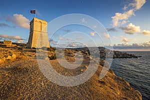 Malta - Ghajn Tuffieha watchtower at Golden Bay before sunset