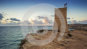 Malta - Ghajn Tuffieha watchtower at Golden Bay before sunset