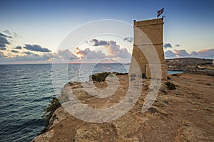 Malta - Ghajn Tuffieha watchtower at Golden Bay before sunset