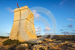 Malta - Ghajn Tuffieha watchtower at Golden Bay before sunset