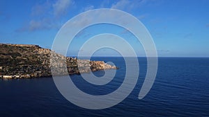 Malta, Gnejna bay aerial view of the sea, horizon and rugged peninsula, Mgar, Maltese island in Mediterranean Sea photo