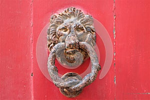 Malta - January 2023 - Decorative bell handler on a wooden door in an old town of Mdina