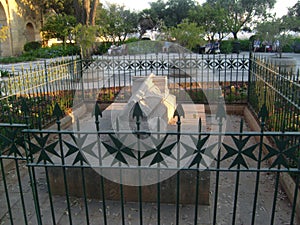 Malta La Valletta main bastion tomb of Hospitaller with characteristic Maltese cross photo